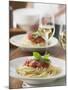 Spaghetti with Tomato Sauce and Glasses of White Wine on Table-null-Mounted Photographic Print