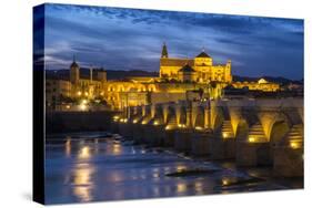 Spain, Andalusia. Cordoba. Roman bridge across the Guadalquivir river at dusk.-Brenda Tharp-Stretched Canvas