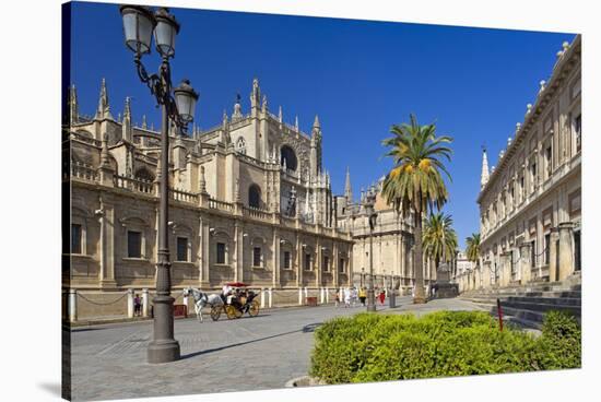 Spain, Andalusia, Seville, Cathedral, Street, Horse-Drawn Carriage-Chris Seba-Stretched Canvas