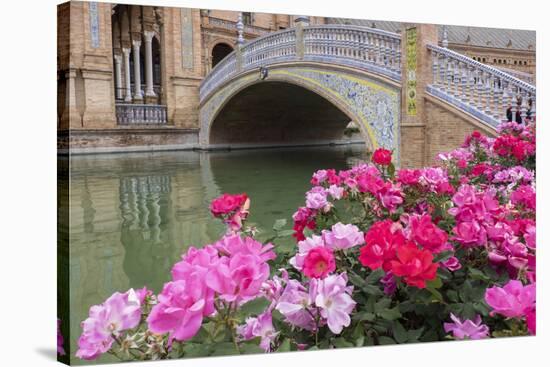 Spain, Andalusia, Seville. Plaza de Espana, ornate bridge with flowers.-Brenda Tharp-Stretched Canvas