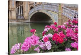 Spain, Andalusia, Seville. Plaza de Espana, ornate bridge with flowers.-Brenda Tharp-Stretched Canvas