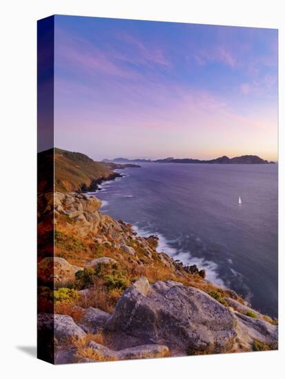 Spain, Galicia, Cangas, Yacht Sailing in Sea at Dusk-Shaun Egan-Stretched Canvas