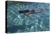 Spain, Ibiza, Cala Jondal. Girl Swimming at Maison De Bang Bang Villa-Katie Garrod-Stretched Canvas