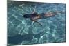 Spain, Ibiza, Cala Jondal. Girl Swimming at Maison De Bang Bang Villa-Katie Garrod-Mounted Photographic Print