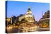 Spain, Madrid. Cityscape at Dusk with Famous Metropolis Building-Matteo Colombo-Stretched Canvas