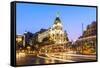 Spain, Madrid. Cityscape at Dusk with Famous Metropolis Building-Matteo Colombo-Framed Stretched Canvas