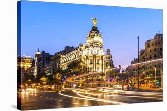 Spain, Madrid. Cityscape at Dusk with Famous Metropolis Building-Matteo Colombo-Stretched Canvas