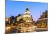 Spain, Madrid. Cityscape at Dusk with Famous Metropolis Building-Matteo Colombo-Mounted Photographic Print