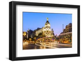 Spain, Madrid. Cityscape at Dusk with Famous Metropolis Building-Matteo Colombo-Framed Photographic Print