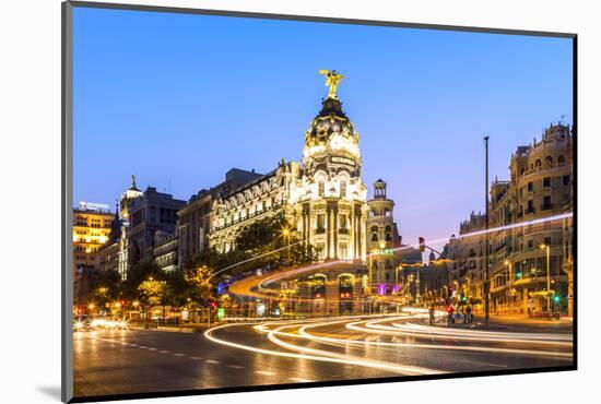 Spain, Madrid. Cityscape at Dusk with Famous Metropolis Building-Matteo Colombo-Mounted Photographic Print