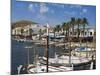 Spain, Menorca; Boats Moored in the Harbour of the Fishing Village of Fornells-John Warburton-lee-Mounted Photographic Print