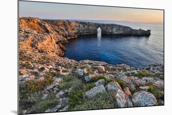 Spain, Menorca. Sunset at Pont d'En Gil (natural arch).-Hollice Looney-Mounted Photographic Print