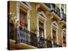 Spain, Sevilla, Andalucia Geraniums hang over iron balconies of traditional houses-Merrill Images-Stretched Canvas