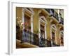 Spain, Sevilla, Andalucia Geraniums hang over iron balconies of traditional houses-Merrill Images-Framed Photographic Print