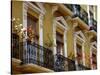 Spain, Sevilla, Andalucia Geraniums hang over iron balconies of traditional houses-Merrill Images-Stretched Canvas