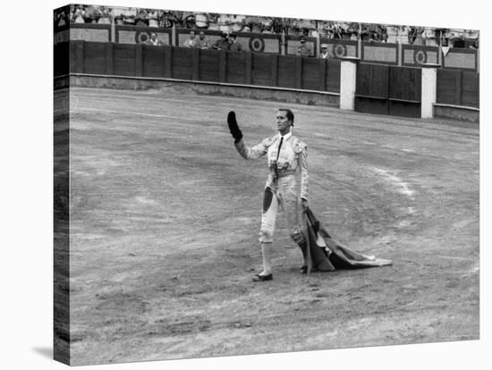Spanish Matador Luis Miguel Dominguin Doffing His Cap as He Acknowledges the Applause of the Crown-Loomis Dean-Stretched Canvas