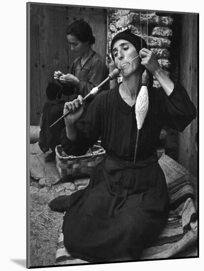 Spanish Peasant Using Ancient Methods to Spin Flax into Thread-null-Mounted Photographic Print