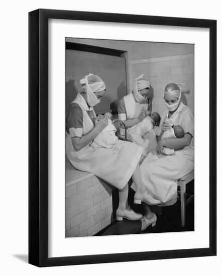 Special Nursery Nurses Wearing Masks as They Bottle-Feed Fully Developed Premature Babies-Hansel Mieth-Framed Photographic Print