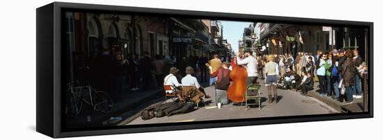 Spectator Looking at Street Musician Performing, Bourbon Street, New Orleans, Louisiana, USA-null-Framed Stretched Canvas