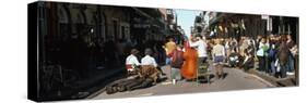 Spectator Looking at Street Musician Performing, Bourbon Street, New Orleans, Louisiana, USA-null-Stretched Canvas