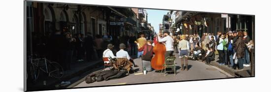 Spectator Looking at Street Musician Performing, Bourbon Street, New Orleans, Louisiana, USA-null-Mounted Photographic Print