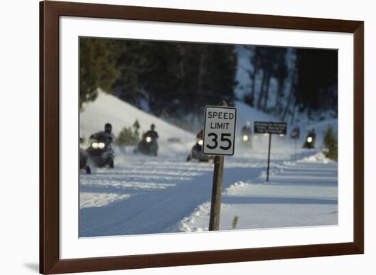 Speed Limit Sign and Snowmobiles-W. Perry Conway-Framed Photographic Print