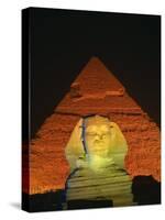 Sphinx and One of the Pyramids Illuminated at Night, Giza, Cairo, Egypt-Nigel Francis-Stretched Canvas