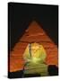 Sphinx and One of the Pyramids Illuminated at Night, Giza, Cairo, Egypt-Nigel Francis-Stretched Canvas