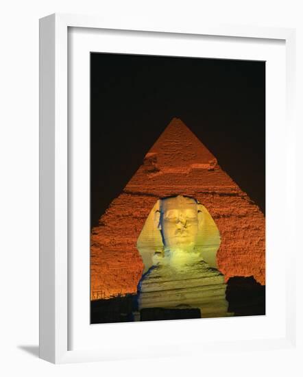 Sphinx and One of the Pyramids Illuminated at Night, Giza, Cairo, Egypt-Nigel Francis-Framed Photographic Print