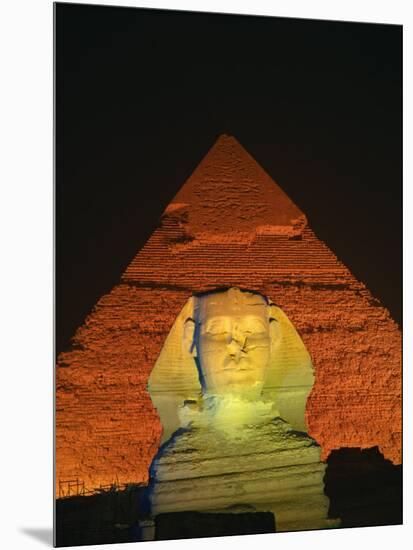 Sphinx and One of the Pyramids Illuminated at Night, Giza, Cairo, Egypt-Nigel Francis-Mounted Photographic Print