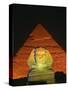 Sphinx and One of the Pyramids Illuminated at Night, Giza, Cairo, Egypt-Nigel Francis-Stretched Canvas