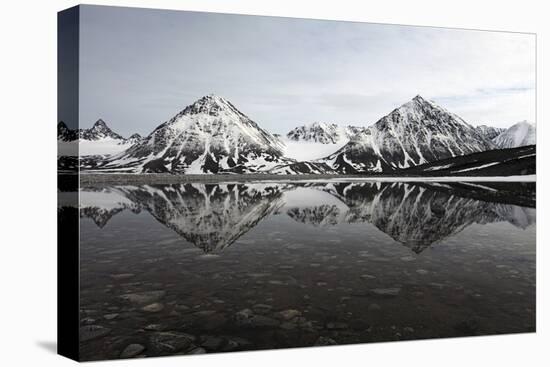 Spitsbergen, Svalbard, Norway. Mountains Reflecting on a Lagoon in Northern Spitsbergen-ClickAlps-Stretched Canvas