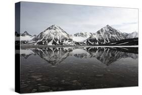 Spitsbergen, Svalbard, Norway. Mountains Reflecting on a Lagoon in Northern Spitsbergen-ClickAlps-Stretched Canvas