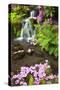 Spring Flowers Add Beauty to Waterfall at Crystal Springs Garden, Portland Oregon. Pacific Northwes-Craig Tuttle-Stretched Canvas