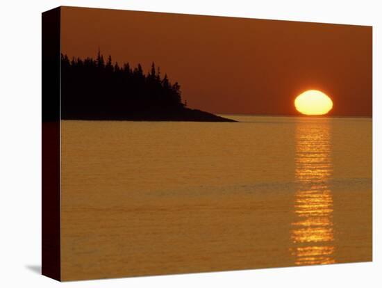 Spring Sunrise Silhouettes Edwards Island and Reflects Light on Lake Superior-Mark Carlson-Stretched Canvas