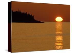 Spring Sunrise Silhouettes Edwards Island and Reflects Light on Lake Superior-Mark Carlson-Stretched Canvas