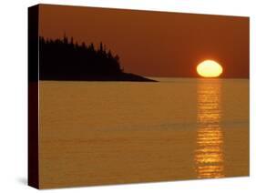 Spring Sunrise Silhouettes Edwards Island and Reflects Light on Lake Superior-Mark Carlson-Stretched Canvas