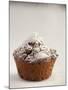 Sprinkling a Chocolate Muffin with Icing Sugar-null-Mounted Photographic Print