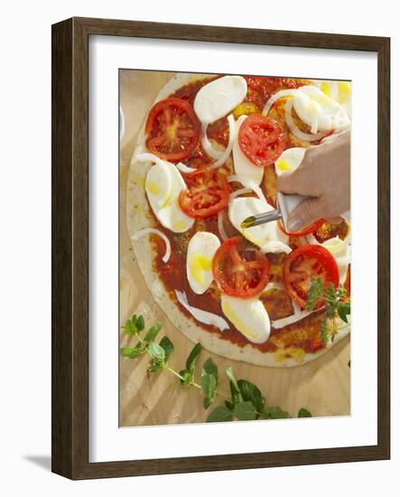 Sprinkling Pizza with Olive Oil-null-Framed Photographic Print