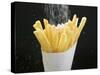 Sprinkling Salt over Chips-null-Stretched Canvas