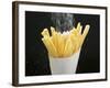 Sprinkling Salt over Chips-null-Framed Photographic Print