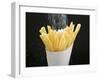 Sprinkling Salt over Chips-null-Framed Photographic Print