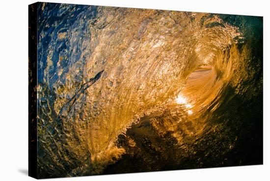 Spun Gold-Inside a tubing wave at sunset, shot from the water, Kirra, Queensland, Australia-Mark A Johnson-Stretched Canvas