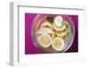 Squeezed Lemons in Water in Glass Bowl-Foodcollection-Framed Photographic Print