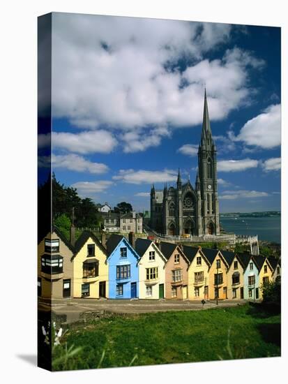 St. Coleman's Cathedral of Cobh Behind Colorful Row Houses-Charles O'Rear-Stretched Canvas