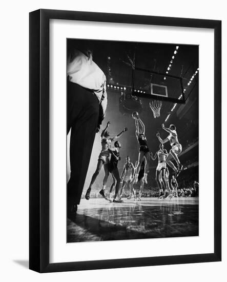 St. John's Defeating Bradley in a Basketball Game at Madison Square Garden-Gjon Mili-Framed Premium Photographic Print
