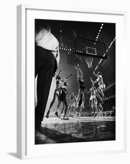 St. John's Defeating Bradley in a Basketball Game at Madison Square Garden-Gjon Mili-Framed Premium Photographic Print