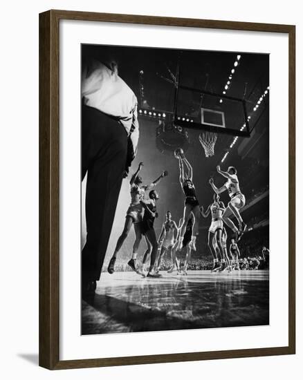 St. John's Defeating Bradley in a Basketball Game at Madison Square Garden-Gjon Mili-Framed Premium Photographic Print