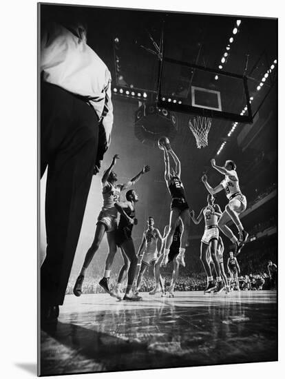 St. John's Defeating Bradley in a Basketball Game at Madison Square Garden-Gjon Mili-Mounted Premium Photographic Print