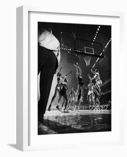 St. John's Defeating Bradley in a Basketball Game at Madison Square Garden-Gjon Mili-Framed Photographic Print